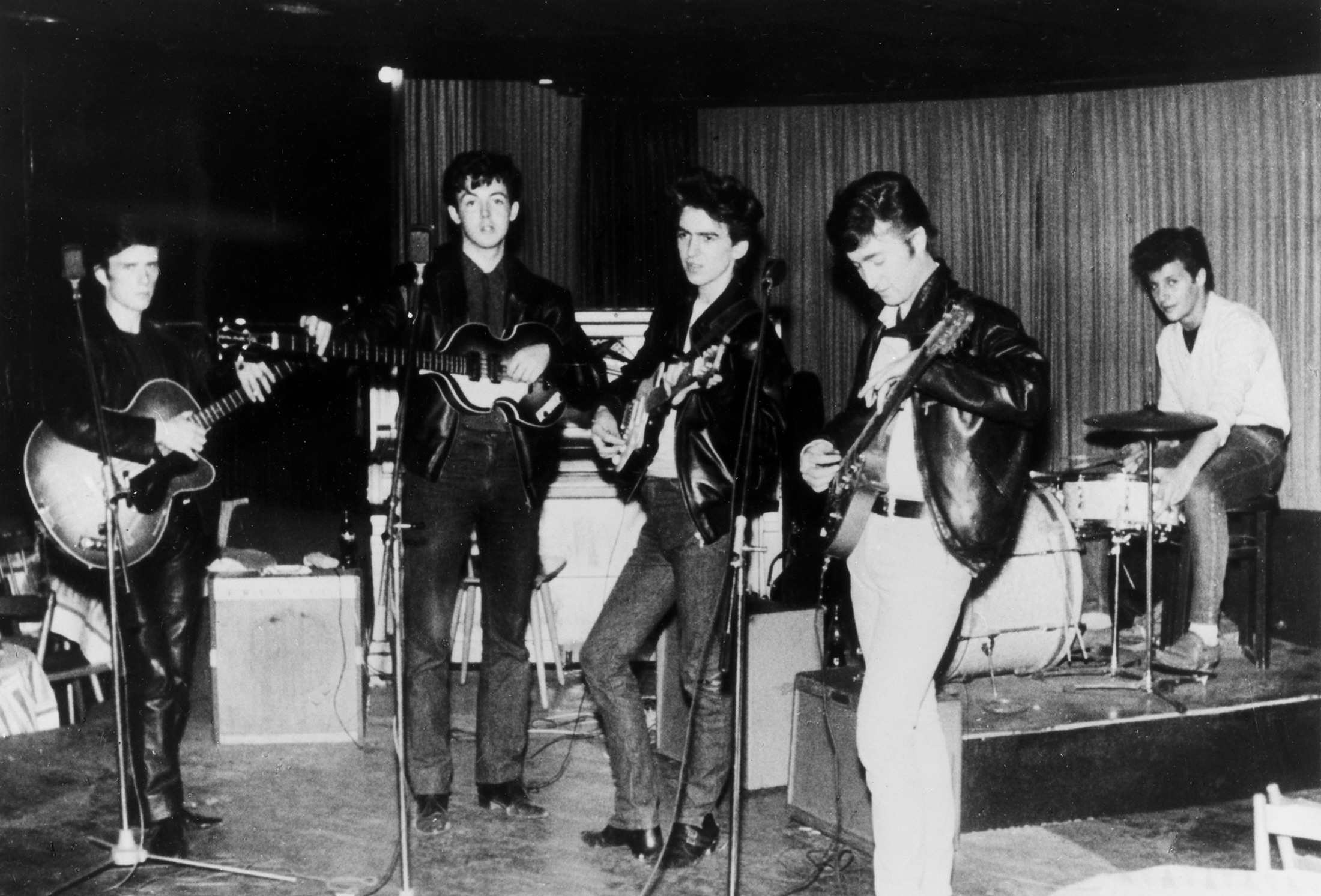 The Beatles perform at the Top Ten Club in Hamburg, West Germany. 